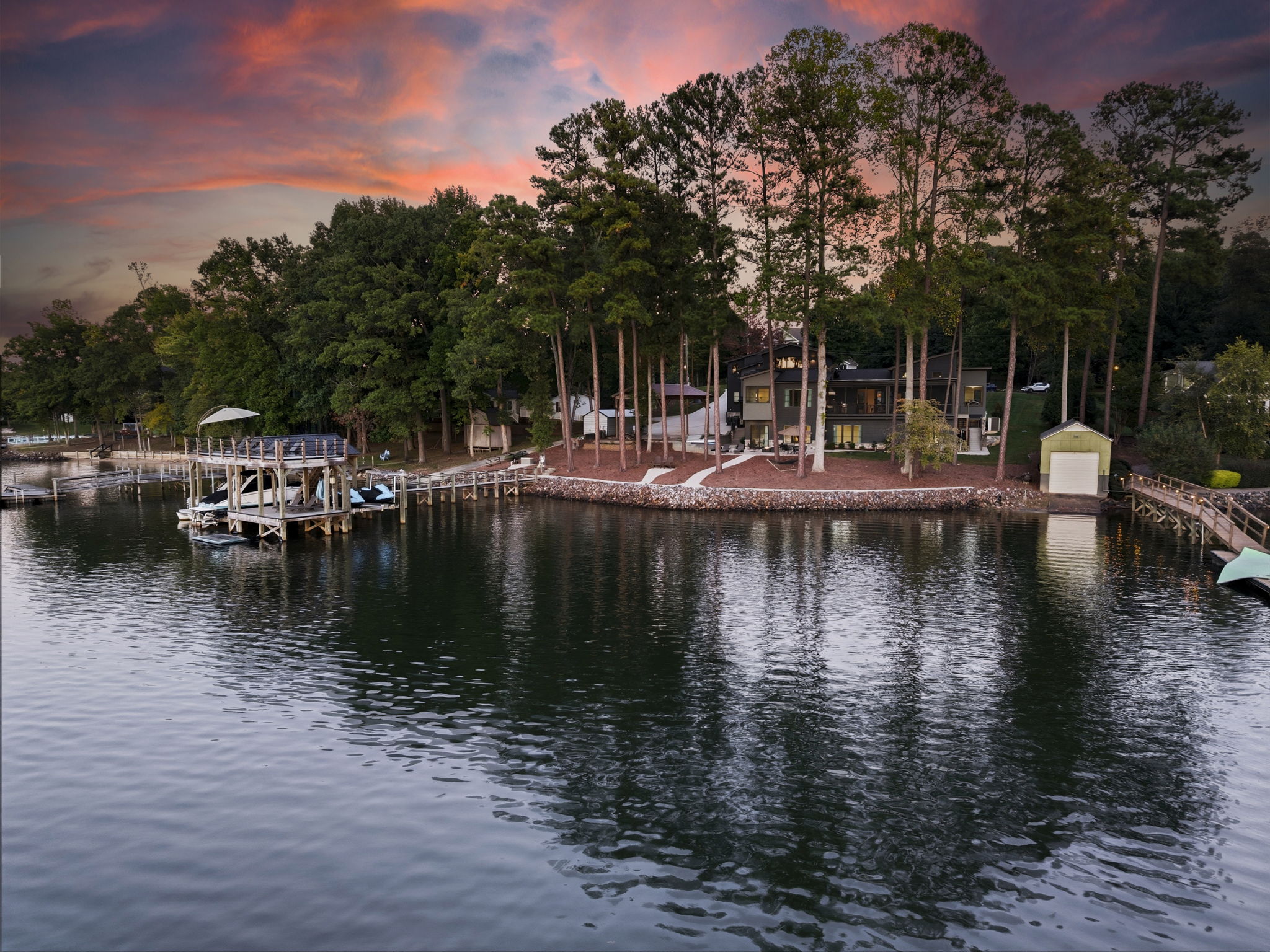 Lake, dock and yard at sunset